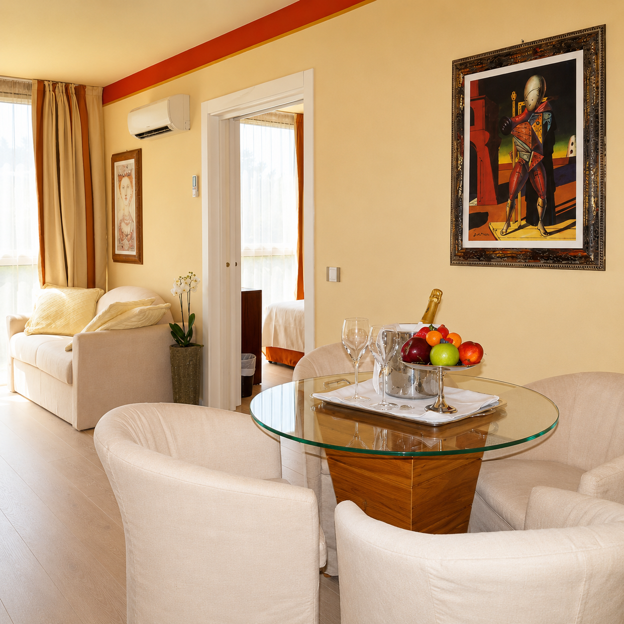 Deluxe Suite bedroom with sunlit window and refined textiles
